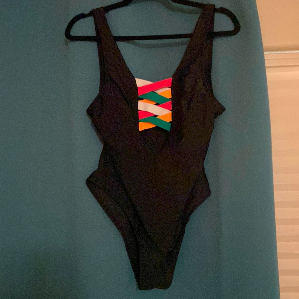 Brand new black bathing suit with a cross cross front.